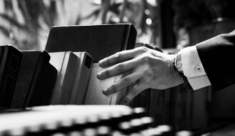 Closeup of hand getting a book